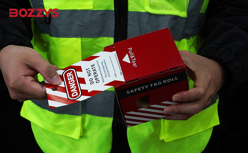 OSHA Compliant LOTO safety tag roll, red and white, in use by BOZZYS Factory