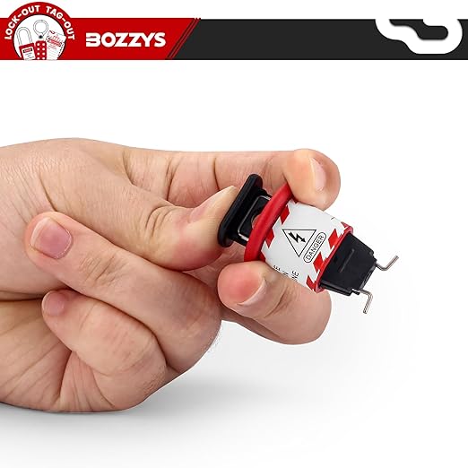 OSHA Compliant LOTO push button switch lockout, red plastic, held in hand by BOZZYS Factory