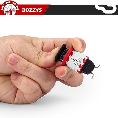 OSHA Compliant LOTO push button switch lockout, red plastic, held in hand by BOZZYS Factory