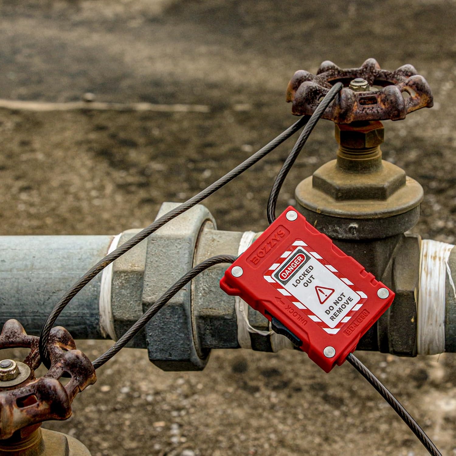 OSHA Compliant LOTO red cable valve lockout device, industrial setting, by BOZZYS Factory