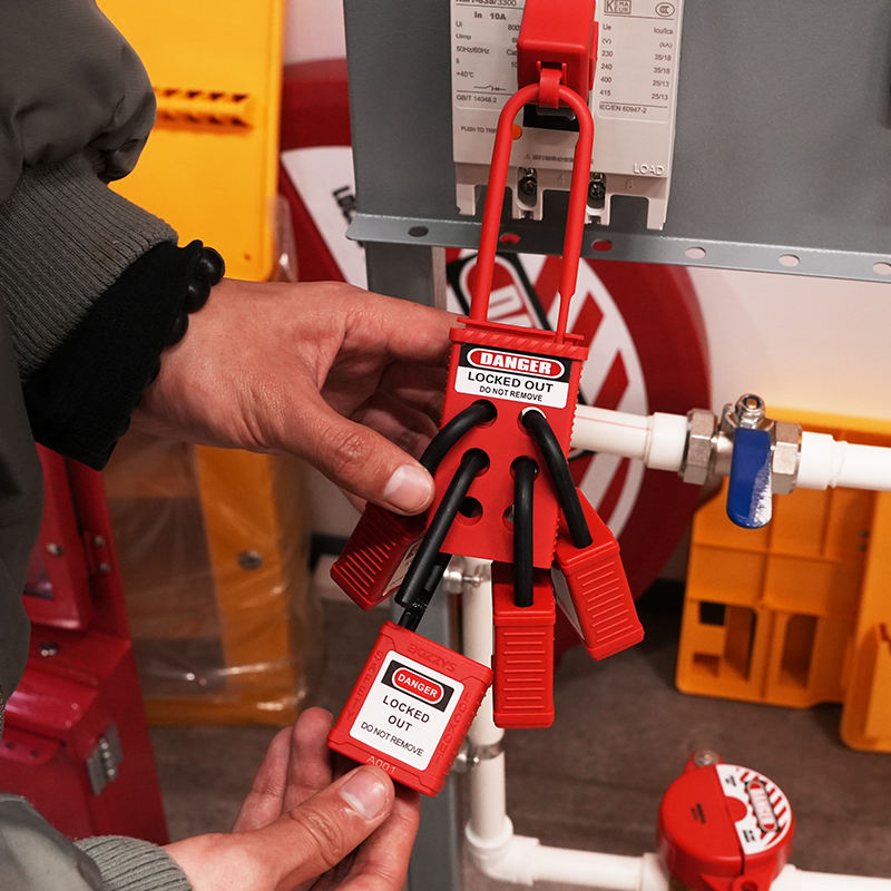 OSHA Compliant LOTO safety padlocks and hasps, red plastic, used in lockout setup by BOZZYS Factory