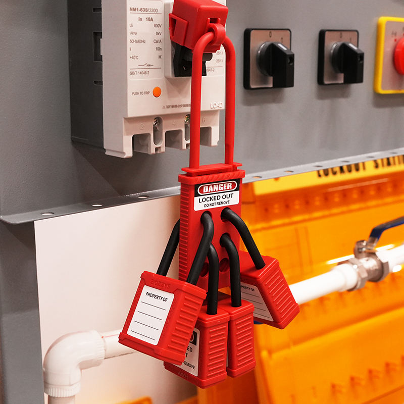 OSHA Compliant LOTO red safety padlocks, plastic material, in use on electrical panel by BOZZYS Factory