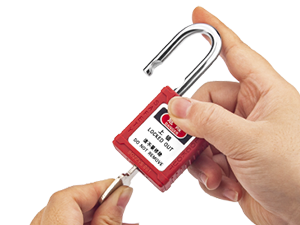 OSHA Compliant red LOTO safety padlock, plastic body, being unlocked, by BOZZYS Factory